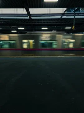 Blurred Motion of Train at Station Platform Stock Photos