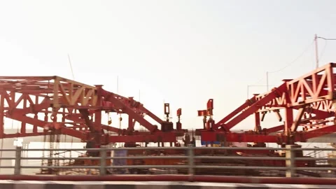 Blurred motion view of a bridge over water from a moving vehicle conveying .. Stock Footage 266385650