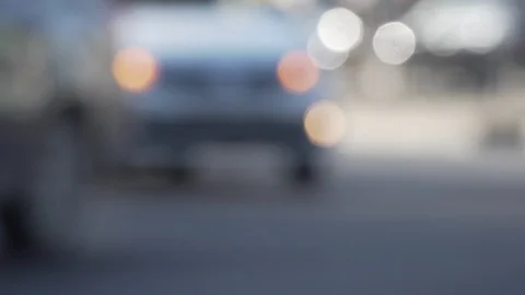 Blurred motion of white turning car and lively crosswalk Stock Footage 116987502
