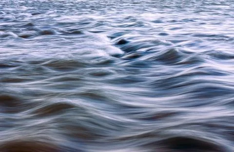 Blurred Mountain River Flow over Big Boulders. Stock Photos