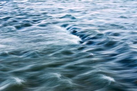 Blurred Mountain River Flow over Big Boulders. Stock Photos