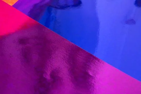 Blurred multicolor trendy backdrop. Bright holographic foil background Stock Photos