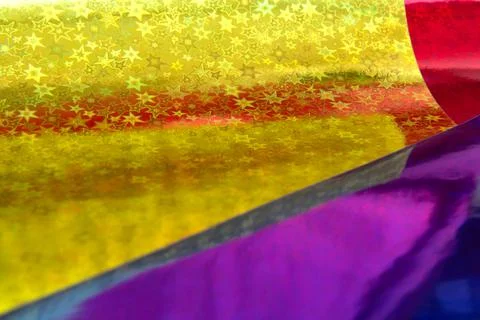 Blurred multicolor trendy backdrop. Bright holographic foil background Stock Photos