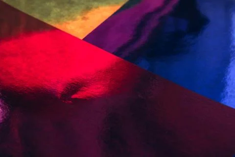 Blurred multicolor trendy backdrop with star. Bright holographic foil backgro Stock Photos