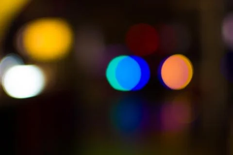 Blurred multicolored highlights on a dark background Stock Photos