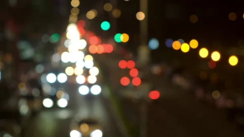 Blurred night traffic lights changing focus in urban area. Stock-Footage 309197843