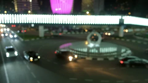 Blurred night traffic rotating around roundabout with bright lights. Stock-Footage 311475084