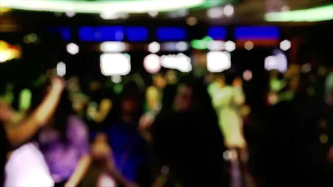 Blurred Nightclub Crowd Dancing Under Neon Lights, Defocused Party Scene Stock Footage 348242534