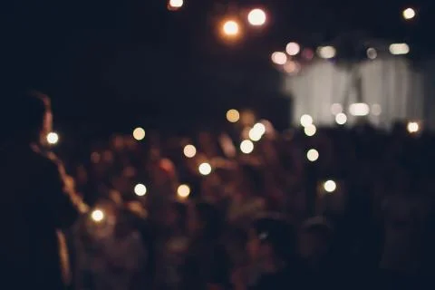 Blurred is not a sharp abstract concert fun background. Large crowd of Stock Photos