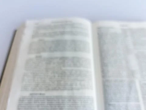Blurred Open Bible in Soft Focus Stock Photos
