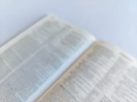 Blurred Open Bible in Soft Focus Stock Photos