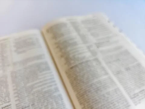 Blurred Open Bible in Soft Focus Stock Photos
