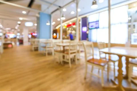 Blurred or Defocus image table dinner in restaurant or food center with bokeh Stock Photos