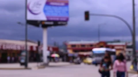 A blurred or defocused view of a large square in a city with a busy crossing Stock Footage 153721211