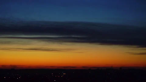 Blurred orange and blue sunset sky background over the town horizon. Soft focus. Stock Footage 256654978