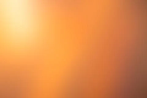 Blurred orange background with pattern. Defocused art abstract ginger gradien Stock Photos