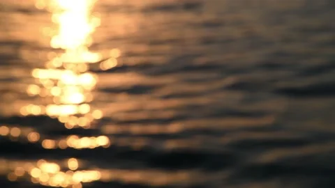 Blurred orange sea at sunset Stock Footage 195933258