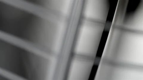 Blurred Oscillating Fan Grille in Close-Up Видео 344964498