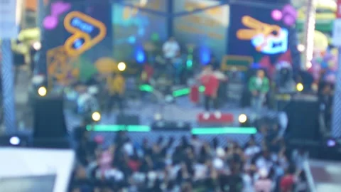 Blurred out of focus to concert area with light flare bokeh flashing in day.. Stock Footage 286309331