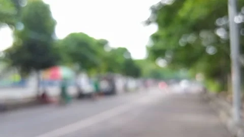 Blurred out focus defocused bokeh people morning activity street Stock Footage 147111075