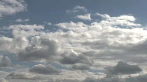 Blurred, out-of-focus, rapidly forming textured white cumulus clouds in blue  Video stock 319221866