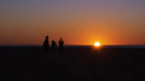 Blurred, out of focus timelapse speed video of people heading towards the sunset Stock Footage 273796946