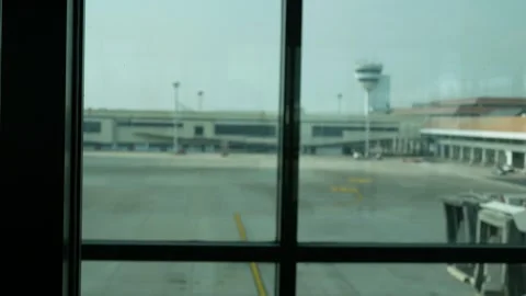 Blurred out of focus View through window of the airport terminal in daytime.. Stock Footage 254153237