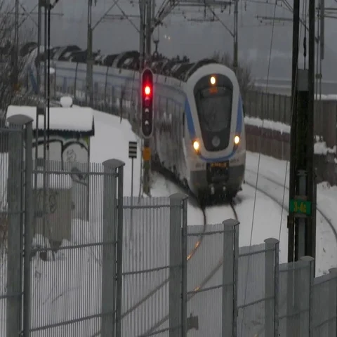 Blurred out train moving in railroad on a heavy snowy day - weather condition Stock Footage 69557915