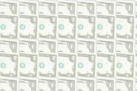 Blurred pattern of banknotes in denominations of one, two dollars Stockfoto's