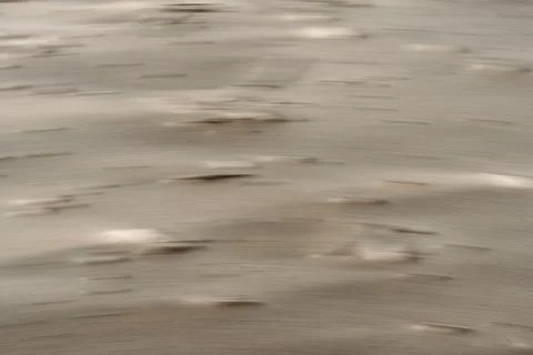 Blurred pattern resembling small beige ripples or bumps in beach sand, are .. Stock Photos