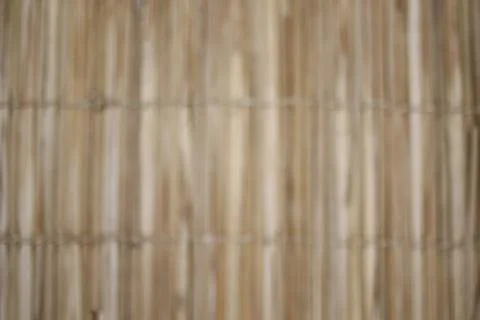 Blurred pattern wood - braided straw fence - handcrafted and beautiful textur Stock Photos