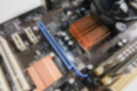 Blurred PCB Closeup of electronic circuit board with CPU processor. Stock Photos