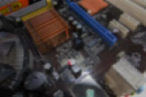 Blurred PCB Closeup of electronic circuit board with CPU processor. Stock Photos