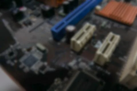 Blurred PCB Closeup of electronic circuit board with CPU processor. Stock Photos