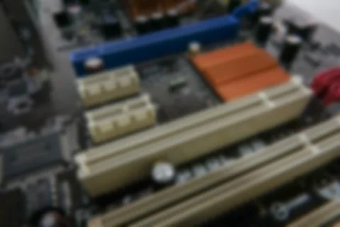 Blurred PCB Closeup of electronic circuit board with CPU processor. Stock Photos