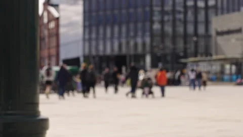 Blurred Pedestrians Walking in Slow Motion with Modern Buildings Behind Stock Footage 309460880