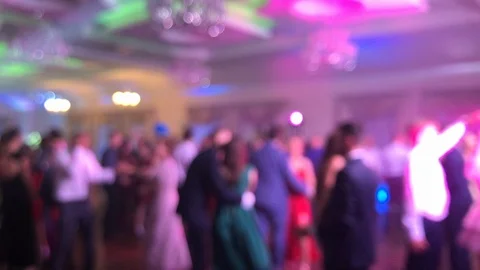 Blurred: People are dancing on the dance floor, colorful lights are Stock Footage 118079971
