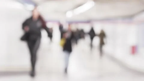 Blurred people commuters walking in underground. Abstract highkey Concept, 4K Stock Footage 234979115