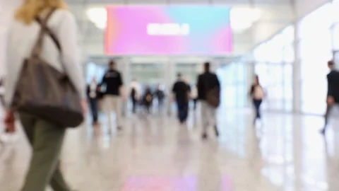 Blurred people passing through in a convention hallway Stock Footage 119823811