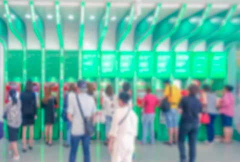 Blurred people use ATM machine Stock Photos