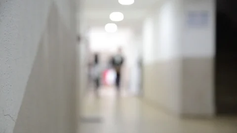 Blurred people walking down the hall. Corridor in modern building. Students Video stock 121815347