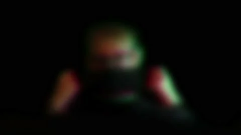 Blurred person drinking from water bottle with face mask pulled down Stock Footage 153438271