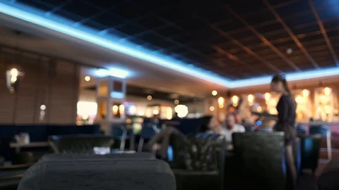 Blurred picture of the interior large beautiful restaurant with bright lighting Stock Footage 105357680