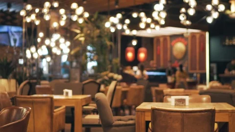 Blurred picture of the interior of a large restaurant with bright lighting Stock Footage 94447293