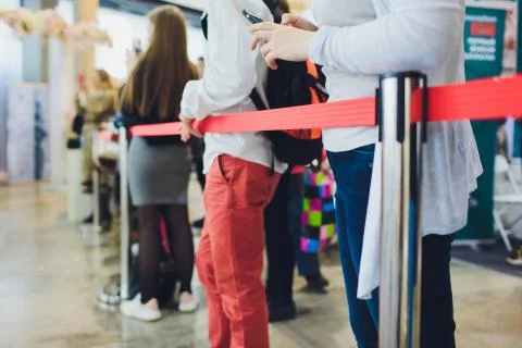 Blurred picture of Long Passenger Queue Waiting for Check-in at Airport Check-in Stock Photos