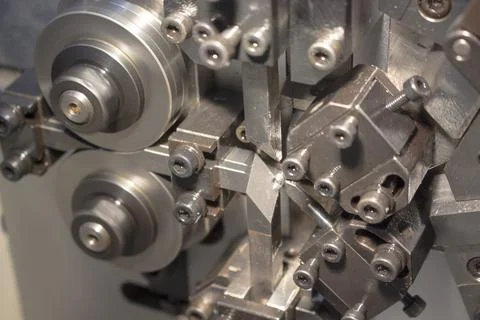 Blurred picture of small spring making machine Stock Photos