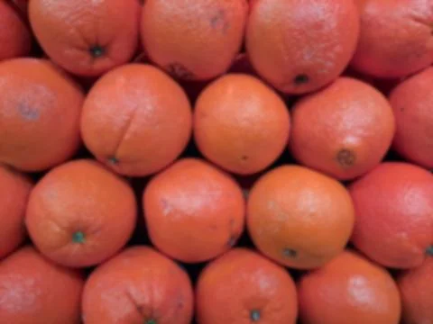 Blurred Piles of Oranges Stock Photos