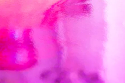 Blurred pink trendy backdrop. Bright holographic foil background Stock Photos