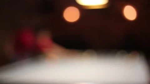 Blurred playing Eight-ball pool billiards in a bar Stock Footage 51780340
