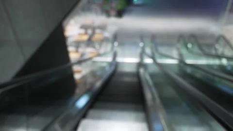 Blurred pov view of descent on Escalator down. 스톡 동영상 340183577